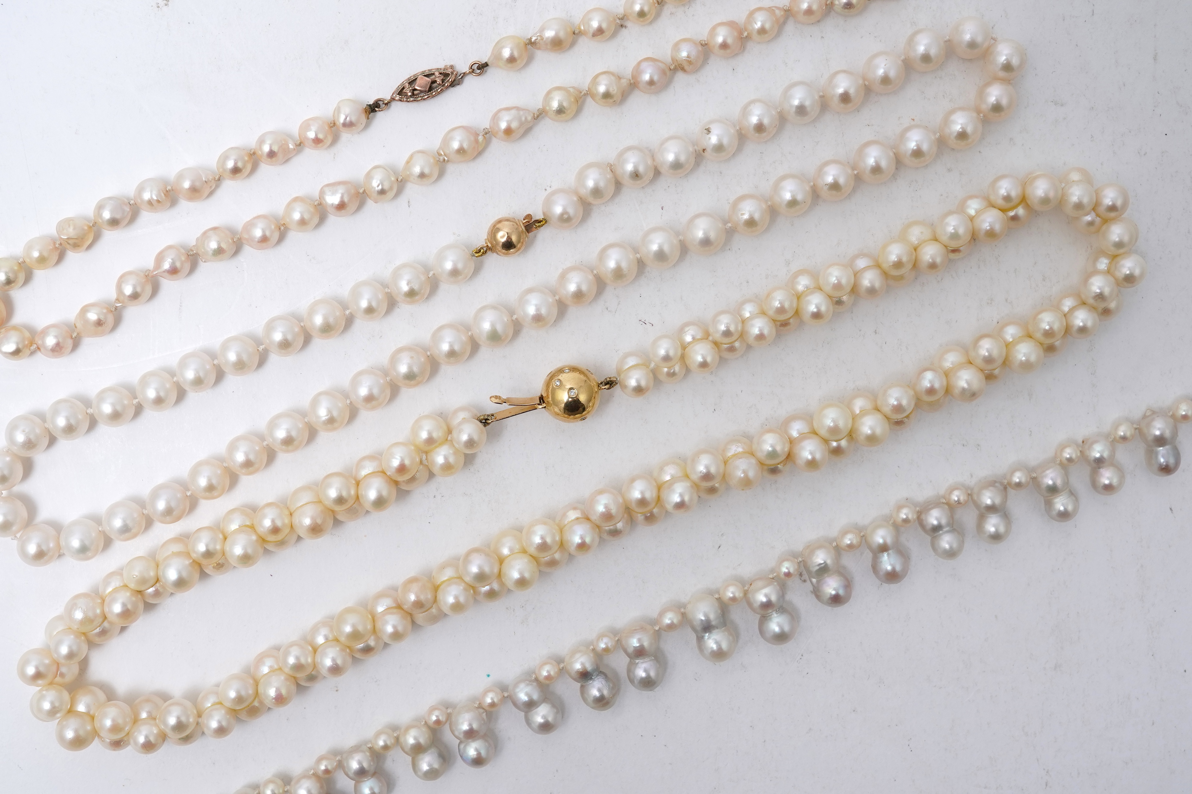 A collection of four cultured pearl necklaces